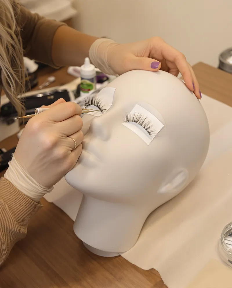 Lash technique being taught on a training head
